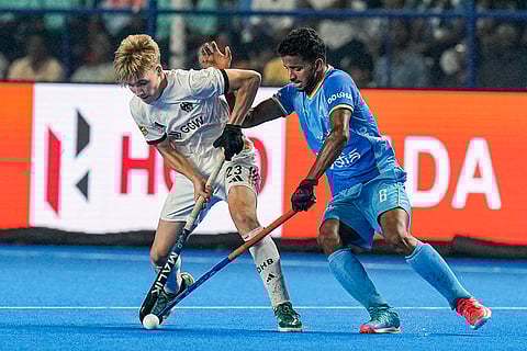 India's Ali Amir (6) and Germany's Wehnert Johann (23) vie for the ball during the semi-final match of the FIH Hockey Men’s Junior World Cup 2025, at Mayor Radhakrishnan Hockey Stadium in Chennai.