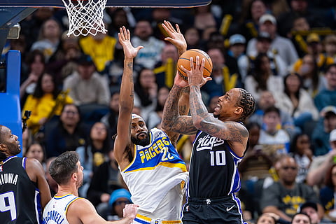 Sacramento Kings guard Demar Derozan (10) shoots while being defended by Indiana Pacers forward Isaiah Jackson during the second half of an NBA basketball game in Indianapolis.