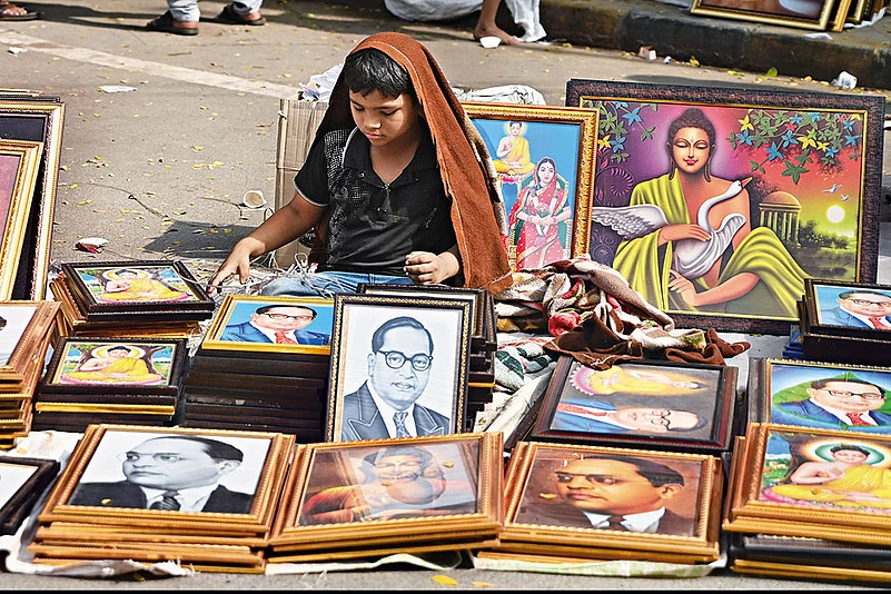 The Icon: A young boy sells portraits of Ambedkar