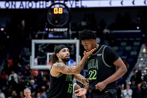 New Orleans Pelicans guard Jose Alvarado (15) tells center Derik Queen (22) to keep his chin up after he missed a last second shot that would have given the Pelicans the lead in the fourth quarter of an NBA basketball game against the San Antonio Spurs in New Orleans.