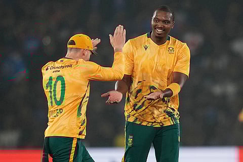 South Africa's Lungi Ngidi, right, celebrates with teammate the wicket of India's captain Suryakumar Yadav during the first T20 International cricket match between India and South Africa in Cuttack, India.