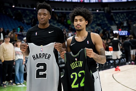 Rookies Derik Queen, left, and Dylan Harper swap jerseys for a photograph after posting career performances in New Orleans.