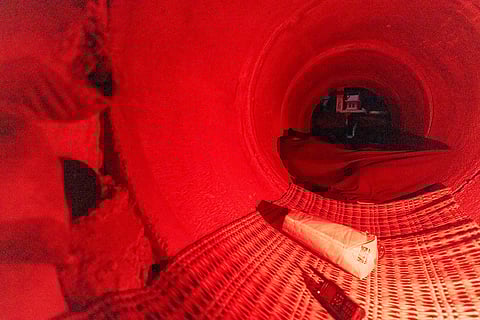 Thai people wrapped in blankets, who fled clashes between Thai and Cambodian soldiers, take shelter in Buriram province, Thailand.