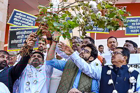Shiv Sena (UBT) MLA Aditya Thackeray (center), Congress leader Vijay Wadettiwar (right) with other Maha Vikas Aghadi leaders during a protest demanding a complete loan waiver for farmers at the Winter session of the Maharashtra Assembly, in Nagpur.