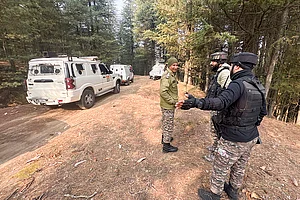 | Photo: PTI : Security personnel conduct searches in the Hutmurah forest area as part of the ongoing investigation linked to the Delhi blast case, in Anantnag district, Jammu and Kashmir.