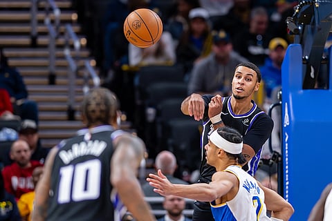 Sacramento Kings forward Keegan Murray makes a pass out to a teammate during the second half of an NBA basketball game against the Indiana Pacers in Indianapolis.