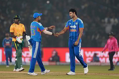 India's Shivam Dube, right, congratulates India's captain Suryakumar Yadav after winning the first T20 International cricket match between India and South Africa in Cuttack.