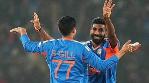 AP Photo/Rafiq Maqbool : India's Jasprit Bumrah celebrates with India's Shubman Gill the wicket of South Africa's Keshav Maharaj during the first T20 International cricket match between India and South Africa in Cuttack, India, Tuesday, Dec. 9, 2025.
