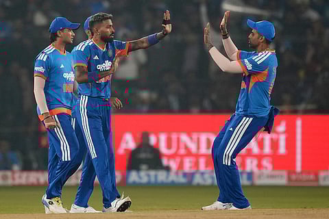 India's Hardik Pandya, centre, celebrates with teammates the wicket of South Africa's David Miller during the first T20 International cricket match between India and South Africa in Cuttack.