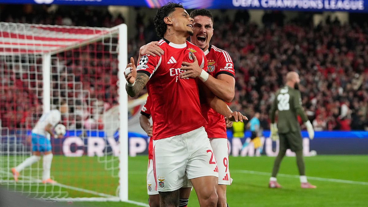 SL Benfica's Richard Rios celebrates with Franjo Ivanovic after scoring his side's first goal during the UEFA Champions League opening phase match against Napoli on December 10, 2025. - | Photo: AP/Armando Franca