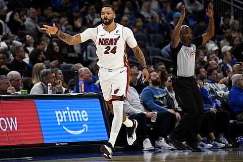 Miami Heat guard Norman Powell (24) reacts after scoring a 3-pointer against the Orlando Magic during the second half of an NBA Cup basketball game, in Orlando, Florida.