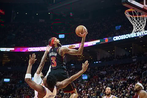 Toronto Raptors' Brandon Ingram (3) drives to the net  during the first half of an NBA Cup basketball game against the New York Knicks in Toronto.