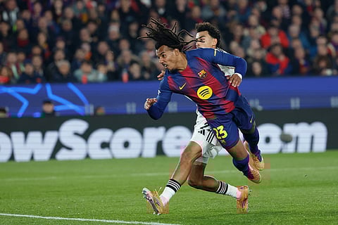 Barcelona's Jules Kounde scores his side's first goal during the Champions League opening phase soccer match between Barcelona and Eintracht Frankfurt in Barcelona, Spain.