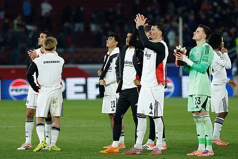 Frankfurt's players clap hand to their supporters after the end of the Champions League opening phase soccer match between Barcelona and Eintracht Frankfurt in Barcelona, Spain.
