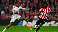 Athletic Bilbao 0-0 PSG LIVE Score, UEFA Champions League: Lions Seek Upset Against European Champions | Photo: AP/Miguel Oses : PSG's Bradley Barcola and Athletic Bilbao's Nico Williams challenge for the ball during their UEFA Champions League opening phase match on December 10, 2025.