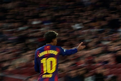 Barcelona's Lamine Yamal, reacts during the Champions League opening phase soccer match between Barcelona and Eintracht Frankfurt in Barcelona, Spain.