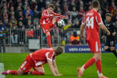 Bayern's Lennart Karl, centre, in action during the Champions League opening phase soccer match between FC Bayern Munich and Sporting CP in Munich, Germany.
