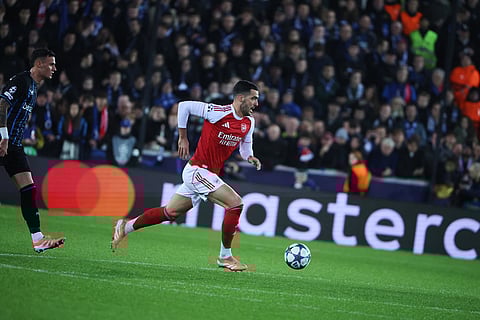 Arsenal's Mikel Merino, right, in action during the Champions League opening phase soccer match between Club Brugge and Arsenal in Bruges, Belgium.