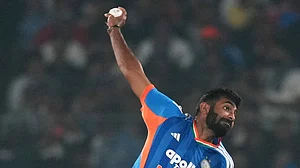 (AP Photo/Rafiq Maqbool) : India's Jasprit Bumrah bowls a delivery during the first T20 International cricket match between India and South Africa in Cuttack, India, Tuesday, Dec. 9, 2025.