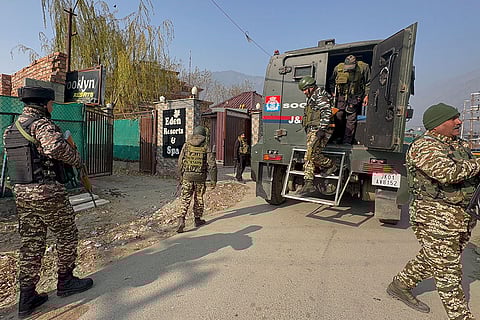 Security personnel during a verification drive across hotels and lodging establishments after a Chinese national Hu Congtai was detained for entering Ladakh and Jammu and Kashmir in violation of his visa stipulations, at Pahalgam, in Anantnag district, Jammu and Kashmir. Congtai has been deported to Hong Kong, officials said here on Thursday. 