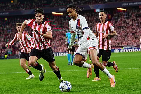 PSG's Bradley Barcola, right, is challenged by Athletic Bilbao's Daniel Vivian during the Champions League opening phase soccer match between Athletic Bilbao and PSG in Bilbao, Spain.