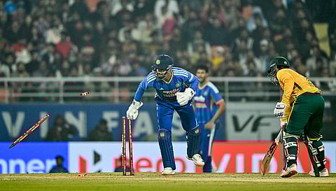 India's Jitesh Sharma dislodges the bails to dismiss South Africa�s Quinton de Kock during the second T20 International cricket match of a series between India and South Africa, at Maharaja Yadavindra Singh International Cricket Stadium, in New Chandigarh.
