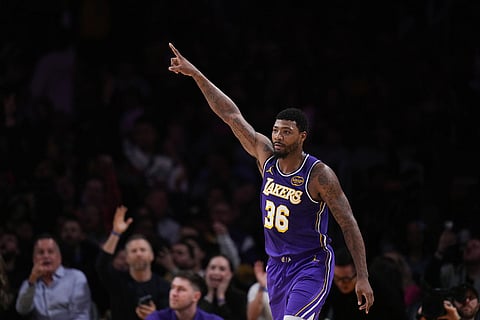 Los Angeles Lakers guard Marcus Smart (36) celebrates his three-point basket during the second half of an NBA Cup basketball game against the San Antonio Spurs in Los Angeles.