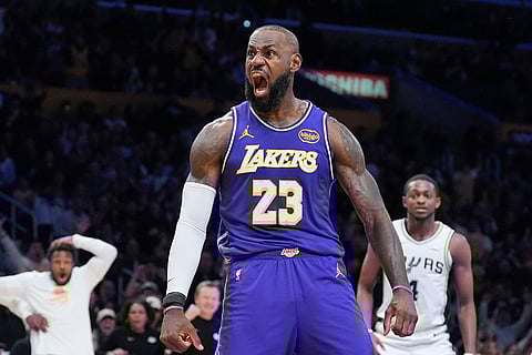 Los Angeles Lakers forward Lebron James (23) reacts after making a dunk during the first half of an NBA Cup basketball game against the San Antonio Spurs in Los Angeles.