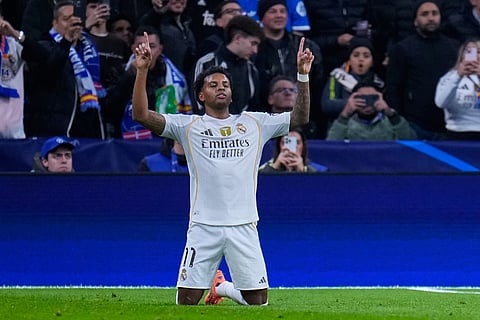 Real Madrid's Rodrygo celebrates after scoring the opening goal during a Champions League opening phase soccer match between Real Madrid and Manchester City, in Madrid, Spain.