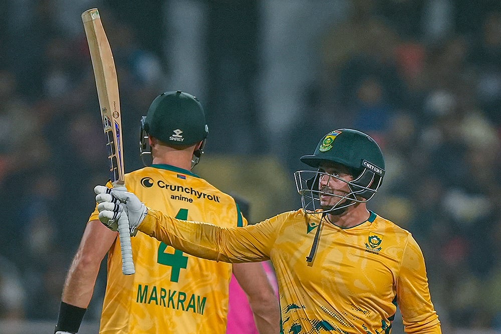 South Africa’s Quinton de Kock, right, celebrates his half century with captain Aiden Markram during the second T20 International cricket match of a series between India and South Africa, at Maharaja Yadavindra Singh International Cricket Stadium, in New Chandigarh. - | Photo: PTI/Shiva Sharma