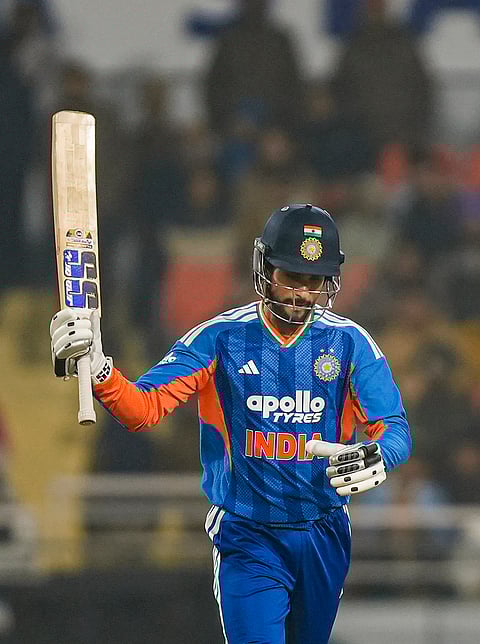 India's Tilak Varma celebrates his half century during the second T20 International cricket match of a series between India and South Africa, at Maharaja Yadavindra Singh International Cricket Stadium, in New Chandigarh.