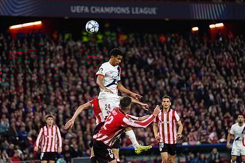 PSG's Senny Mayulu jumps for a header during the Champions League opening phase soccer match between Athletic Bilbao and PSG in Bilbao, Spain.