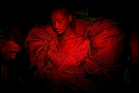 A model wears a design by De La Cierva y Nicolas backstage during Fashion Week in Madrid, Spain, Sept. 19, 2025. 