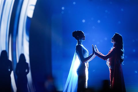 Miss Mexico Fatima Bosch, right, and Miss Thailand Praveenar Singh hold hands while waiting for the announcement of the winner for the 2025 Miss Universe pageant in Nonthaburi, Thailand, Nov. 21, 2025. 