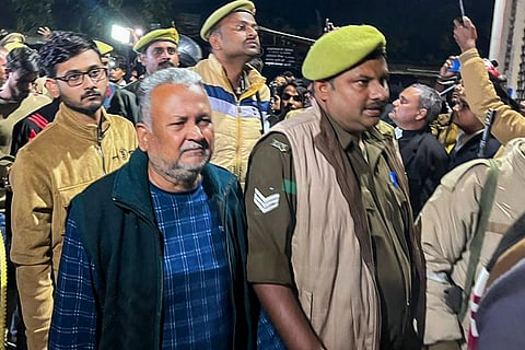 Police take an accused after presenting him in the Bahraich court in connection with the violence that occurred during idol immersion in the Maharajganj area, in Bahraich.