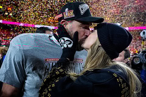 Kansas City Chiefs tight end Travis Kelce and Taylor Swift kiss after the AFC Championship NFL football game against the Buffalo Bills, in Kansas City, Mo.,  Jan. 26, 2025. 
