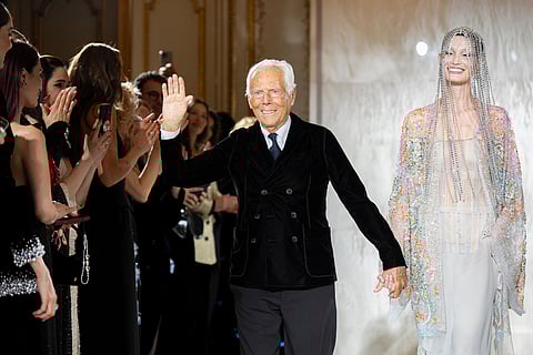 Giorgio Armani waves at the end of his Prive Haute Couture Spring/Summer 2025 collection in Paris, Jan. 28, 2025. 
