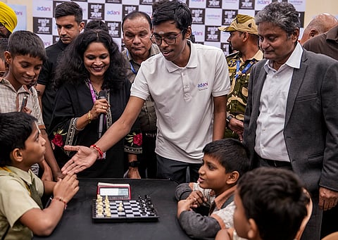Chess grandmaster R Praggnanandhaa interacts with school students during the Dharavi Schools Chess Championship 2025, organised for children from over 30 Dharavi schools at the District Sports Club, in Mumbai.