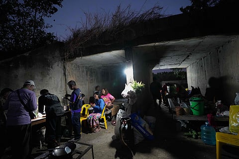 Thai residents cover in a shelter in Buriram province, Thailand.