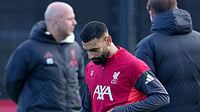 Salah Set For Fresh Talks With Slot As Liverpool Boss Addresses Egyptian Star’s Future | Photo: AP/Jon Super : Liverpool's Mohamed Salah passes manager Arne Slot as he takes part in a training session on December 8, 2025.