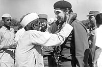 A Century of Red: The Indian Communist Movement India Cuba: An elderly villager and member of indian communist party garlanding Che Guevara during his visit to a Community Project Area in Delhi, 1959