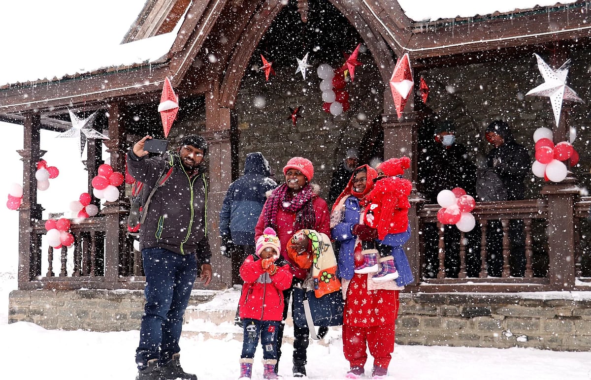 A Family enjoying snowfall