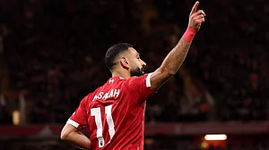 Mohamed Salah celebrates after assisting Hugo Ekitike's second goal.