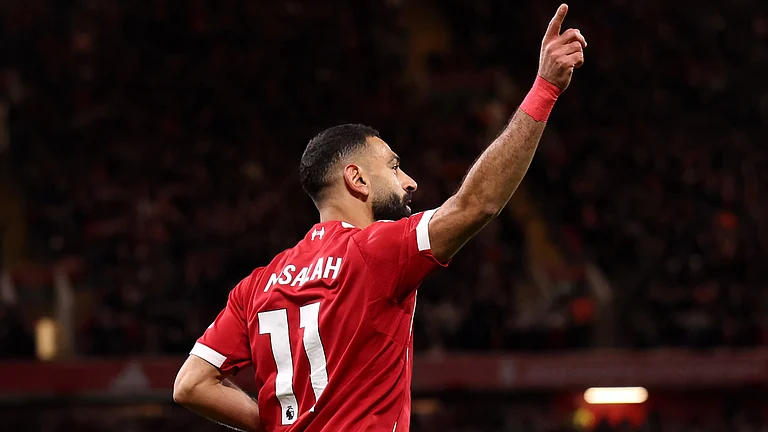 Mohamed Salah celebrates after assisting Hugo Ekitike's second goal. - null