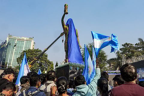 A partially covered 70-feet statue of Argentine footballer Lionel Messi, in Kolkata. Messi is scheduled to virtually unveil the statue as part of the 'G.O.A.T. India Tour 2025'. 