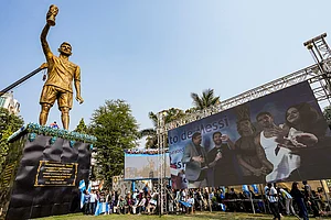 | Photo: PTI/Manvender Vashist Lav : Argentine footballer Lionel Messi with TMC MLA Sujit Bose virtually unveils his 70-feet statue as part of his 'G.O.A.T. India Tour 2025', in Kolkata.