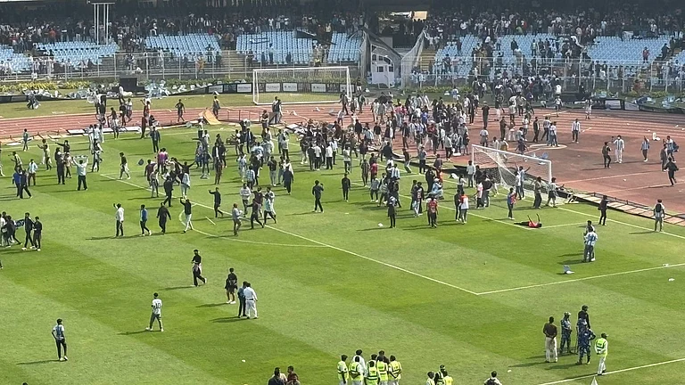 Fans invading the pitch at the Salt Lake Stadium in Kolkata during Lionel Messi's GOAT India Tour 2025. - Sushruta Bhattacharjee/Outlook