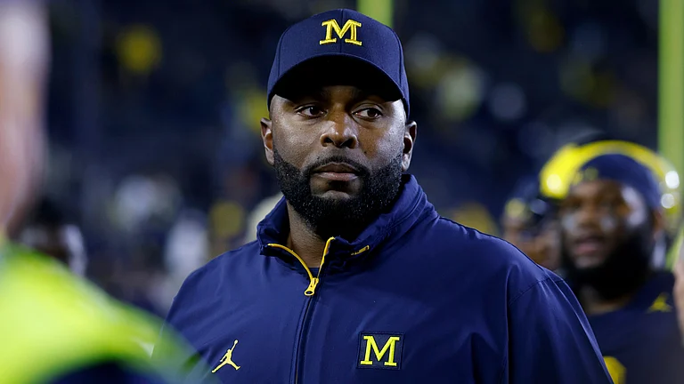 FILE - Michigan coach Sherrone Moore walks off the field following an NCAA football game on Saturday, Aug. 30, 2025, in Ann Arbor, Mich - (AP Photo/Al Goldis, File)
