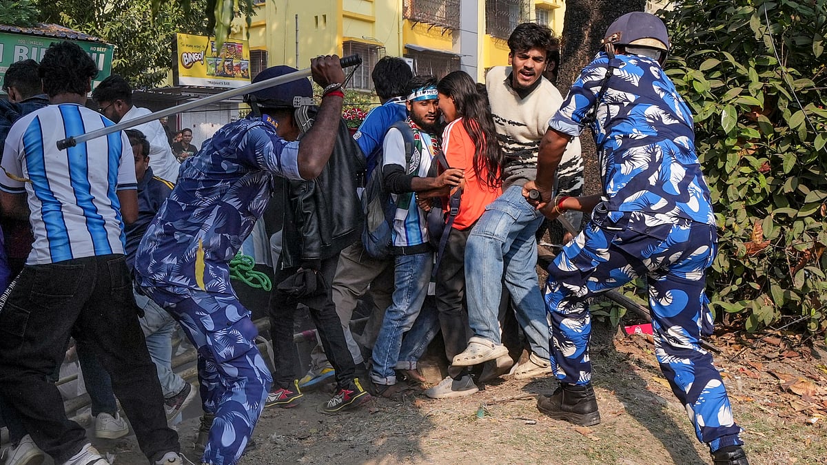 Security personnel lathi-charge fans after they gathered near the Salt Lake Stadium following chaos at an event of Argentine footballer Lionel Messi as part of his 'G.O.A.T. India Tour 2025', in Kolkata. - PTI
