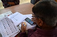 Of Targets And Threats: How Jharkhand’s SIR Is Crushing BLOs IMAGO/ZUMA Press Wire : A Booth Level Officer (BLO) Re-verifying the voter card during the Special Revision (SR) of the electoral roll